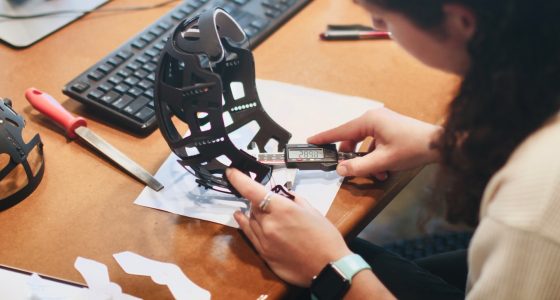 person holding black and white star wars r 2 d 2 toy